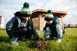 Pupils helping at the tree planting event.