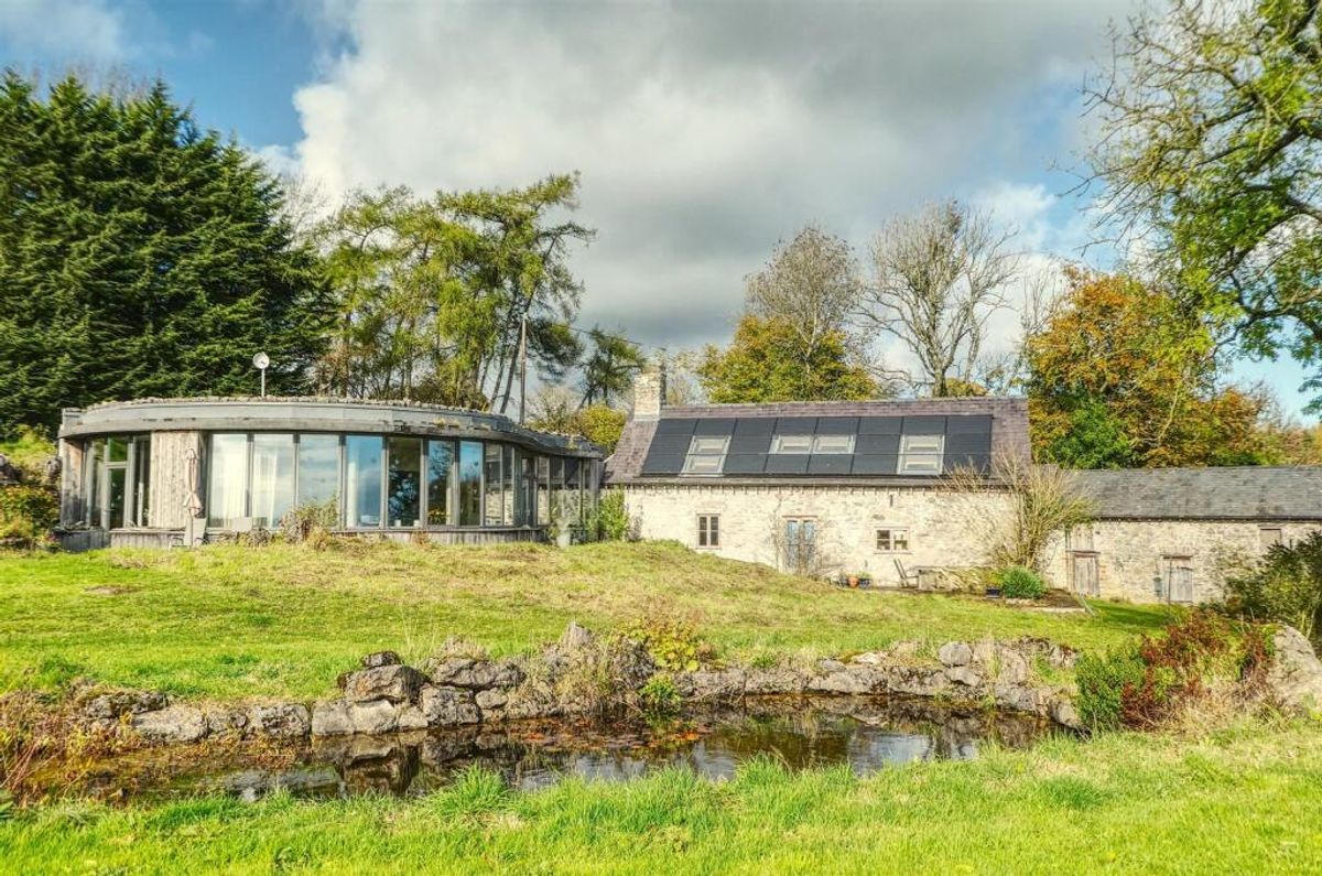 Exceptional Grade II-listed farmhouse near Oswestry with stunning curved glass eco extension listed for sale