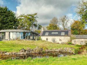 Supporting image for story: Exceptional Grade II-listed farmhouse near Oswestry with stunning curved glass 'eco extension' listed for sale