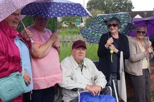 Carney Walsh, 90, watches the carnival