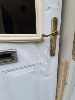The door of the property was smashed during the raid  