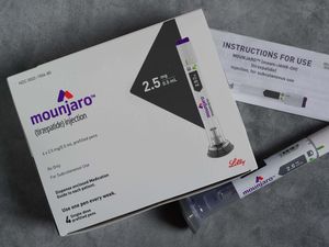 Mounjaro injection next to its packaging (Alamy/PA)