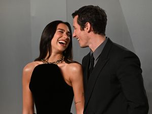 Supporting image for story: Dua Lipa and Callum Turner lead couples on red carpet at Vanity Fair Oscar Party