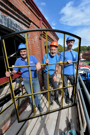 Alec Brew, centre, replacing the windows at Tettenhall Transport Heritage Centre