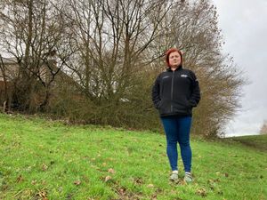 Rianne Marvin with the trees residents say are wrecking their homes. Picture Martyn Smith/LDRS free for LDRS use