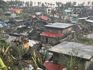 Damaged houses caused by Typhoon Man-yi in the north-eastern Philippines