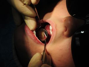 A person receives dental treatment