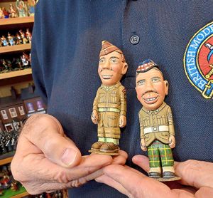 Two wooden soldiers on parade