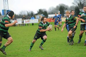 Market Drayton RFC (Green) v Shrewsbury (Blue) at Greenfields, Market Drayton. Phillip Bradley makes a run with the ball for Market Drayton. 