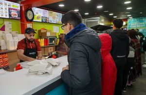 Image shows people queuing for £1 chicken and chips at Hajees Original Fish and Chips in Birmingham on Sunday January 18 2026.