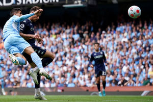 Manchester City's Joao Cancelo, left, fails to stop Aston Villa's Matty Cash from scoring his sides first goal during the English Premier League soccer match between Manchester City and Aston Villa at the Etihad Stadium in Manchester, England, Sunday, May 22, 2022. (AP Photo/Dave Thompson).