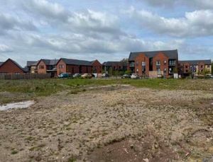 View to the west of the site with Extra Care apartments looking out onto the associated parking court. Picture: Corstorphine & Wright