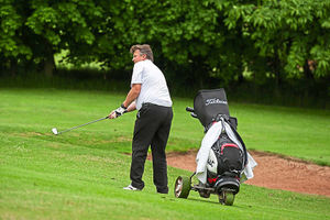 Andrew Porter chips on to the green during his first round. Picture by Richard Dawson.