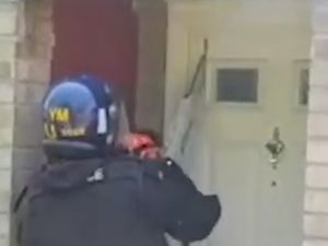 Supporting image for story: Police use chainsaw to slice open suspected drug den