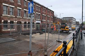 The area is fenced off on both sides while engineers work