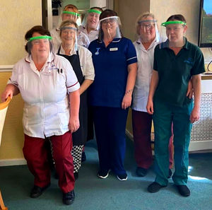 Care staff at Weston House residential home receive an early Rotary delivery of face visors.