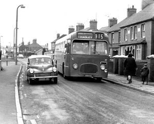 Trench Road, Trench. Traffic on March 11, 1971. Here we see a Midland Red bus and a Morris Minor car