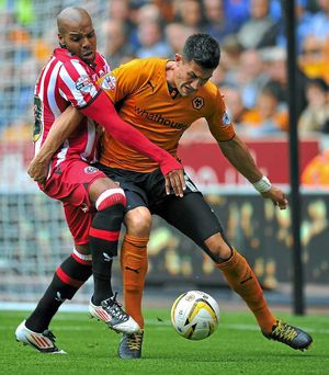 Sheffield United's Marlon King (left) battles with  Wolverhampton Wanderers' Danny Batth (right) 