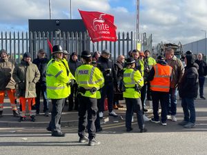 Police officers on hand as members of Unite go on the picket line at Birmingham City Council's Atlas Depot in Tyseley, Birmingham.
