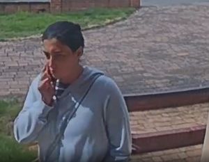 One of the suspects was seen with a mobile phone. Photo: West Midlands Police