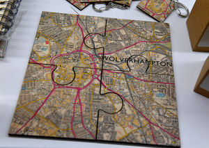 WOLVERHAMPTON COPYRIGHT NATIONAL WORLD PLC TIM THURSFIELD 13/10/23.Wooden postcards, coaster jigsaws and keyrings, which all simply depict the map of Wolverhampton, are flying off the shelves at Wolverhampton Art Gallery..