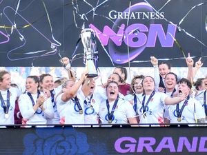 England players lift the Six Nations trophy