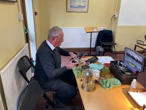 Allan Read repairs a clock