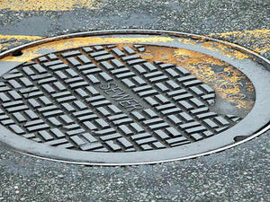 Supporting image for story: Manhole cover thefts put Mid Wales drivers at risk