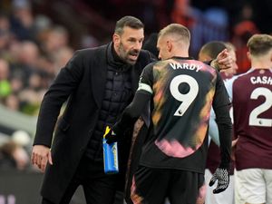 Leicester manager Ruud van Nistelrooy (left) speaks to Leicester forward Jamie Vardy (right) during a Premier League match at Villa Park