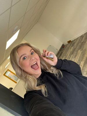 Imogen with the keys to the new shop 