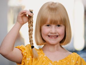 Supporting image for story: Little Polly loses locks to help others