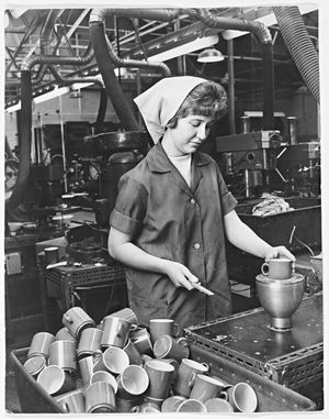 BIP Plastics Ltd., Oldbury, March 12, 1966. 'Sandra testing a new cup, she can "finish off" about 3,500 cups a day using the filing machine which removes the "flash" from the cups.'
