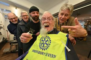 Shrewsbury Rotarian Peter Love 'in the chair' at Risdons Barbers at Shrewsbury Market Hall with barber Mat Glover and Branch President Johnathan Callwood. At the very back are Rotarians John Yeomans and Alun Humphreys.