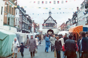 Crowds in the High Street beneath the bunting