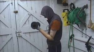 Bob gets into shape with weights in his garage