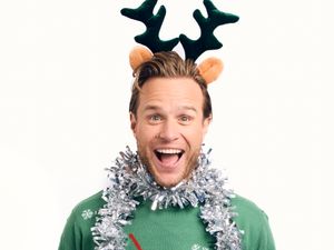 Olly Murs in tinsel and reindeer headwear