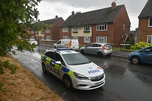 Police cars remained at the scene of Fountain Lane after the incident