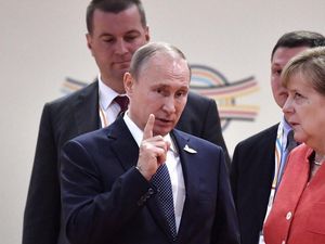 Supporting image for story: Angela Merkel rolling her eyes next to Vladimir Putin has got people guessing like crazy
