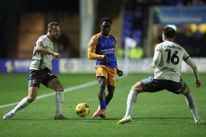 Ismeal Kabia of Shrewsbury Town and Reece Staunton of Grimsby Town