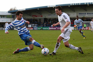 Darren Pond of Oxford City challenges Matty McGinn of AFC Telford United