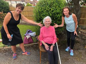Supporting image for story: Elderly woman still in lockdown delighted as choir surprises her with driveway performance 