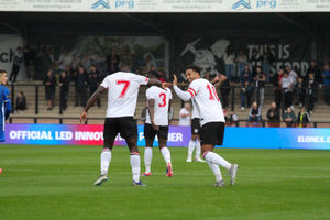 Hednesford Town’s Dominic McHale celebrates with Ahkeem Rose (left). Picture via: Harry Owen
