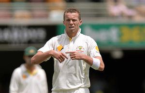 Australia's Peter Siddle reacts after injuring his finger