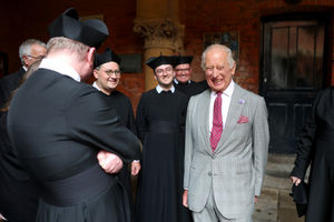 King Charles III laughs with Fathers during his visit to the Oratory of St Philip Neri, Birmingham, following the canonisation of Cardinal John Henry Newman ahead of visit to Midland Metropolitan Hospital