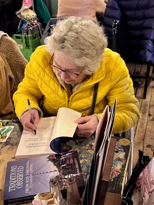 Anna Hallett signing copies of her new book