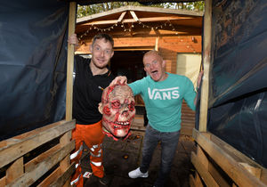With the giant Halloween maze he built in his back garden, (left) Michael Marsden with friend Ryan Vickers, who will be helping to scare party guests on the night