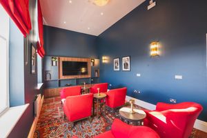 Communal spaces retain original features and architecture such as stained-glass windows.