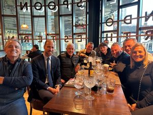 The Prince of Wales meeting Aston Villa supporters round a pub table