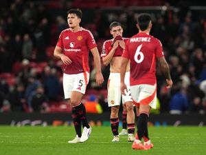 Harry Maguire (left) and Manuel Ugarte (centre) look dejected after a game