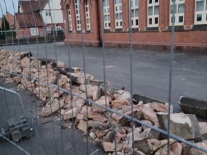 Supporting image for story: 'Just like the Crooked House': Residents' anger over demolition of a historic stone wall in village near Dudley